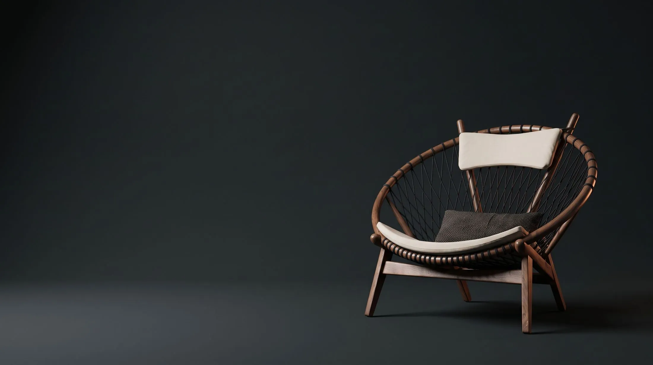 Wood and rope lounge chair on a dark background, studio view